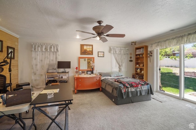 carpeted bedroom featuring access to outside, a textured ceiling, ornamental molding, and ceiling fan