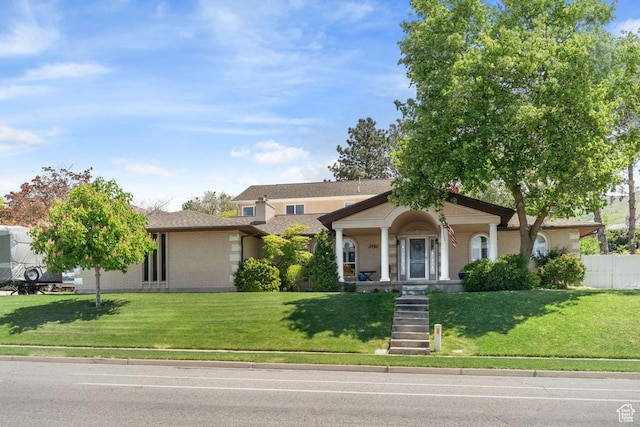 view of front of house featuring a porch and brick siding