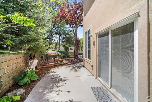 view of patio / terrace with area for grilling and fence