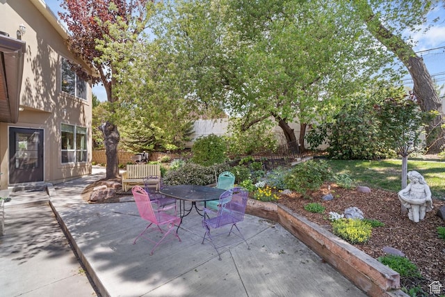 view of patio / terrace featuring outdoor dining space and fence