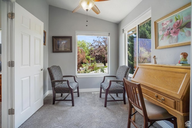 living area featuring carpet, vaulted ceiling, ceiling fan, and baseboards