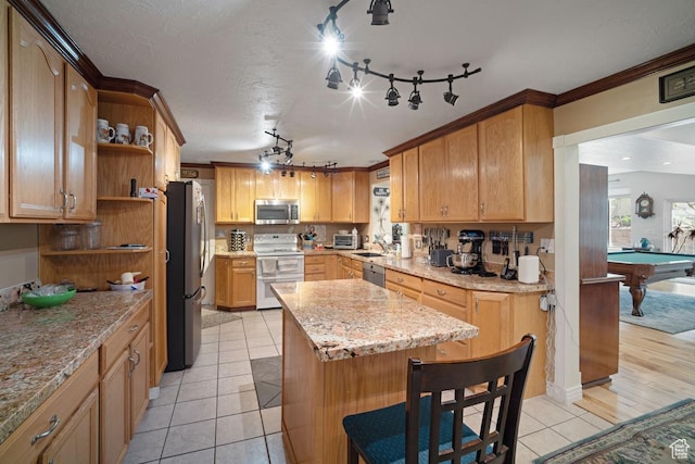 kitchen featuring appliances with stainless steel finishes, open shelves, light tile patterned flooring, a kitchen island, and rail lighting