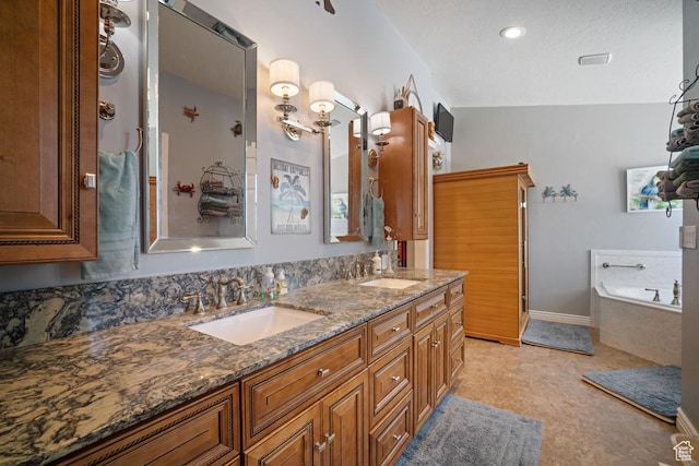 bathroom featuring double vanity and a garden tub