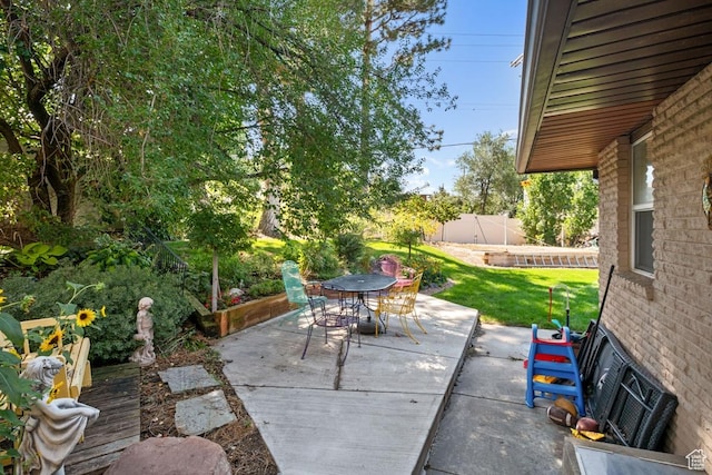 view of patio / terrace with outdoor dining area and fence