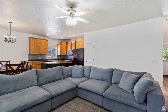 2099 W 700 S, Syracuse, UT 84075 - living room featuring ceiling fan, recessed lighting, a chandelier, and wood finished floors