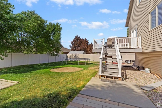 2099 W 700 S, Syracuse, UT 84075 - view of yard with a trampoline, stairs, a wooden deck, and a patio