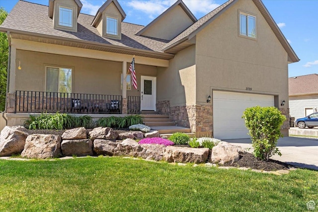 2099 W 700 S, Syracuse, UT 84075 - view of front facade with a porch, stone siding, stucco siding, a front yard, and an attached garage