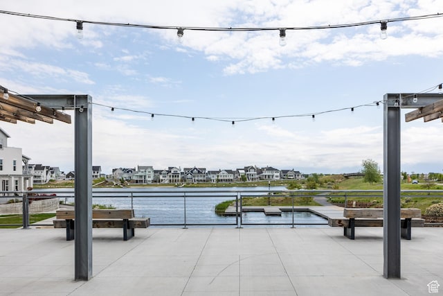 view of home's community with a water view and a residential view