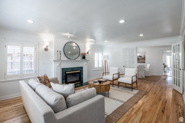 1845 E Princeton Ave, Salt Lake City, UT 84108 - living area with ornamental molding, a fireplace, baseboards, french doors, and wood finished floors