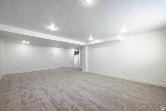 1845 E Princeton Ave, Salt Lake City, UT 84108 - finished basement with a textured ceiling, baseboards, and light colored carpet