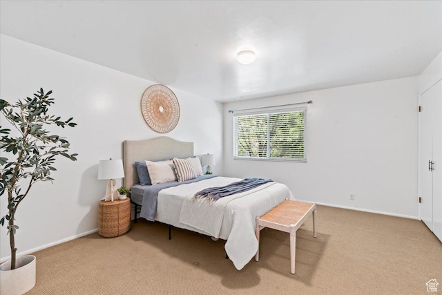 carpeted bedroom with baseboards
