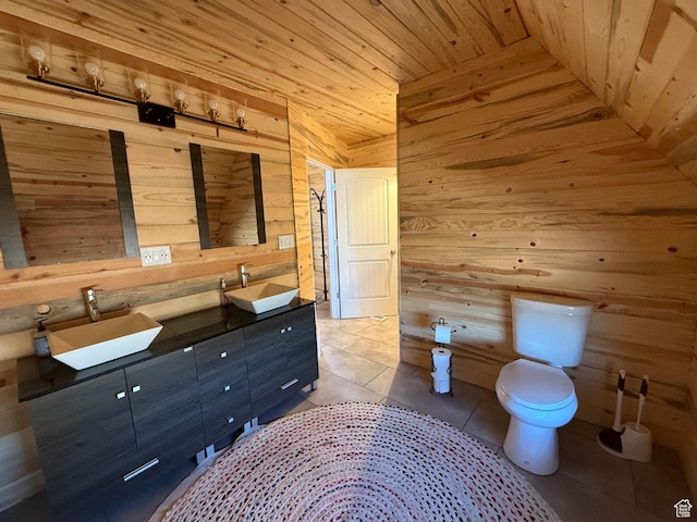 3431 S Panorama Dr, Garden City, UT 84028 - bathroom with wood walls, toilet, double vanity, tile patterned floors, and wood ceiling