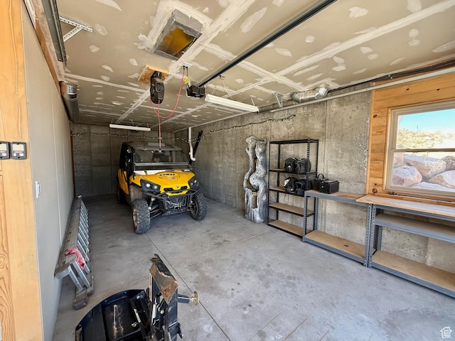 3431 S Panorama Dr, Garden City, UT 84028 - garage featuring a garage door opener