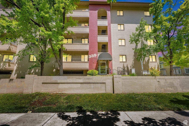 339 E 600 S Unit 1111, Salt Lake City, UT 84111 - view of apartment building / complex featuring fence
