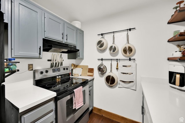 339 E 600 S Unit 1111, Salt Lake City, UT 84111 - kitchen with electric range, under cabinet range hood, open shelves, light countertops, and dark wood-type flooring