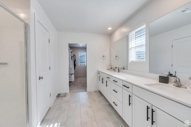 2571 N Geranium Dr W Unit 239, Saratoga Springs, UT 84045 - full bathroom featuring plenty of natural light, double vanity, baseboards, an enclosed shower, and recessed lighting