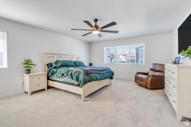 2571 N Geranium Dr W Unit 239, Saratoga Springs, UT 84045 - bedroom featuring light colored carpet, baseboards, and ceiling fan
