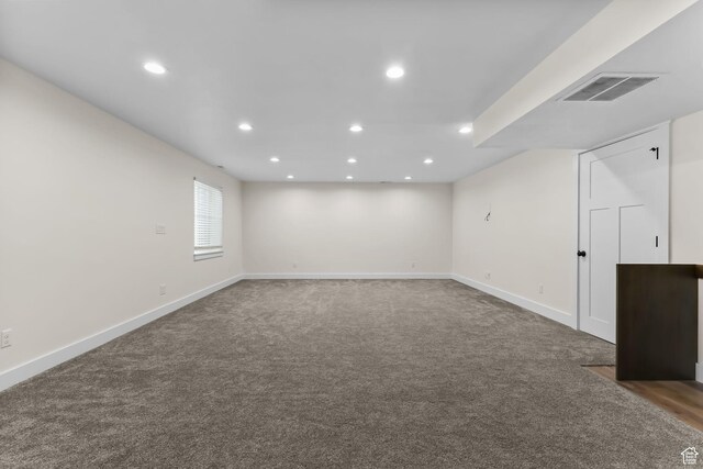 basement with carpet flooring, recessed lighting, and baseboards