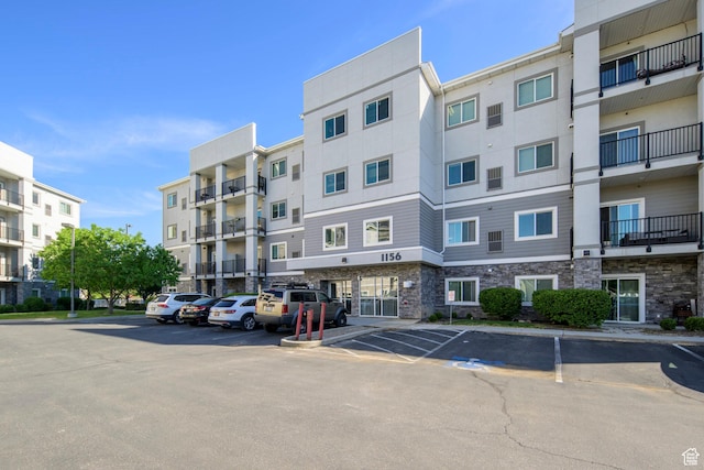 view of property with uncovered parking
