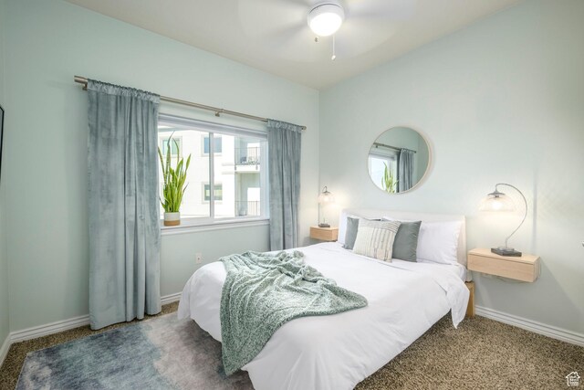 bedroom featuring carpet flooring, baseboards, and a ceiling fan