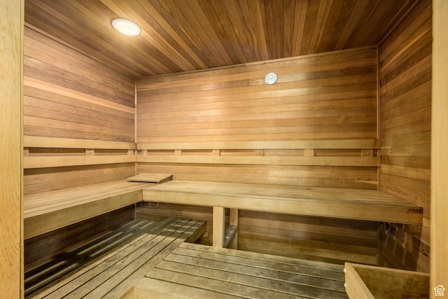 sauna / steam room featuring wooden walls and wooden ceiling