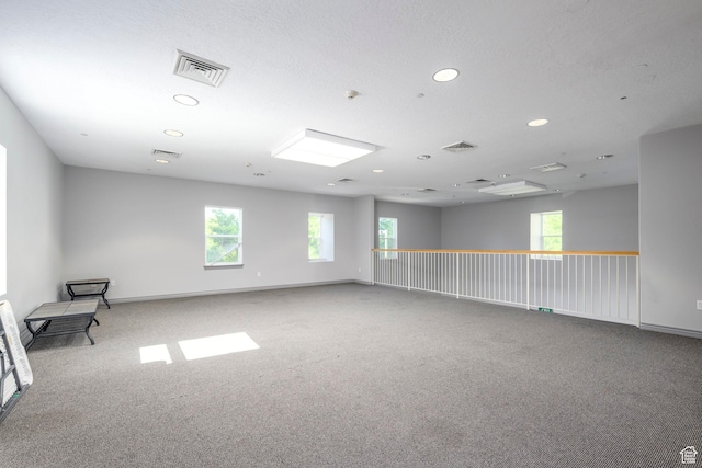 empty room with recessed lighting, carpet floors, and baseboards