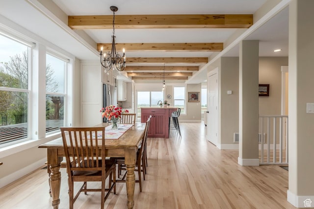 1920 S Wall St, Heber City, UT 84032 - dining room with light wood-style floors, beamed ceiling, a chandelier, and baseboards