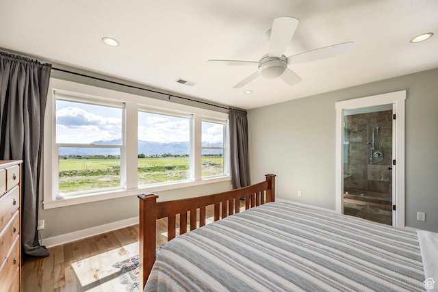 1920 S Wall St, Heber City, UT 84032 - bedroom featuring multiple windows, baseboards, light wood-type flooring, recessed lighting, and ensuite bath