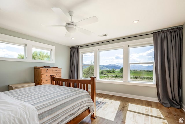 1920 S Wall St, Heber City, UT 84032 - bedroom featuring light wood finished floors, baseboards, recessed lighting, a mountain view, and ceiling fan