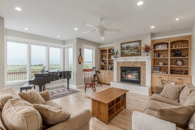 1920 S Wall St, Heber City, UT 84032 - living room with ceiling fan, recessed lighting, a glass covered fireplace, light wood finished floors, and baseboards