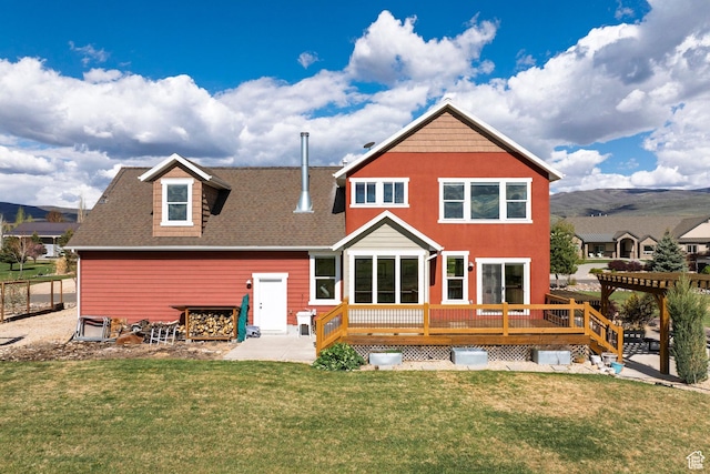 1920 S Wall St, Heber City, UT 84032 - back of property featuring a wooden deck, a yard, a shingled roof, and a patio
