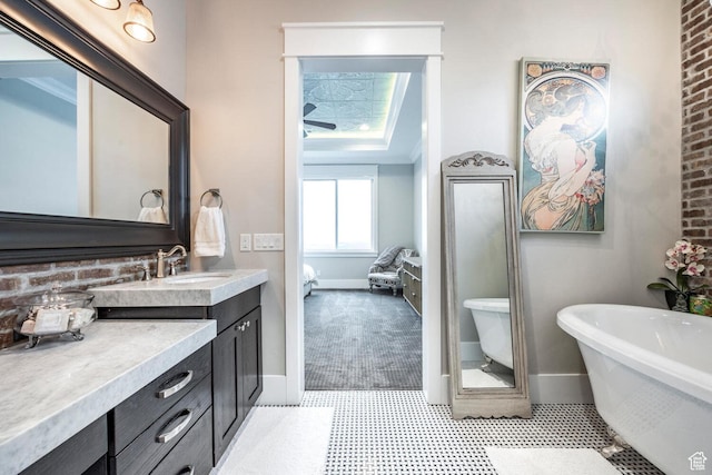 5314 W Rolling Brook Dr, Herriman, UT 84096 - ensuite bathroom featuring vanity, baseboards, and a freestanding bath