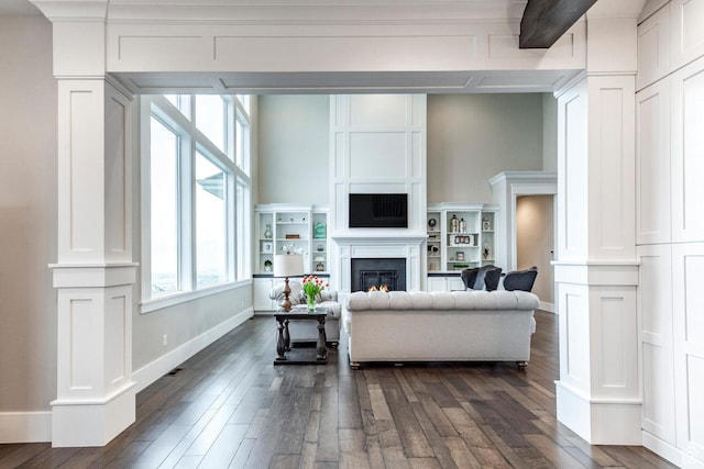 5314 W Rolling Brook Dr, Herriman, UT 84096 - living room with dark wood-type flooring, a glass covered fireplace, and baseboards