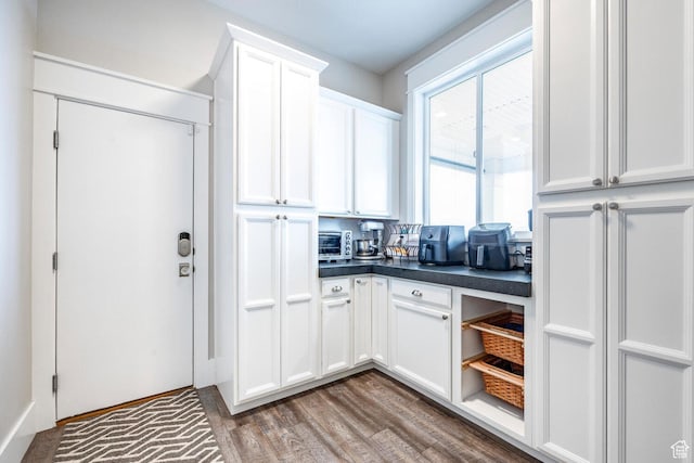 5314 W Rolling Brook Dr, Herriman, UT 84096 - kitchen with dark countertops, white cabinetry, wood finished floors, and open shelves