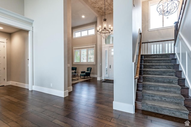 5314 W Rolling Brook Dr, Herriman, UT 84096 - foyer entrance featuring a chandelier, stairway, dark wood-style flooring, baseboards, and a towering ceiling