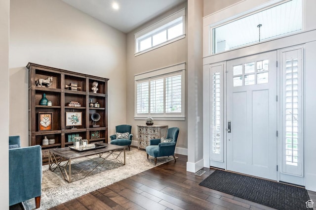 5314 W Rolling Brook Dr, Herriman, UT 84096 - foyer entrance with a high ceiling, dark wood-style flooring, and baseboards