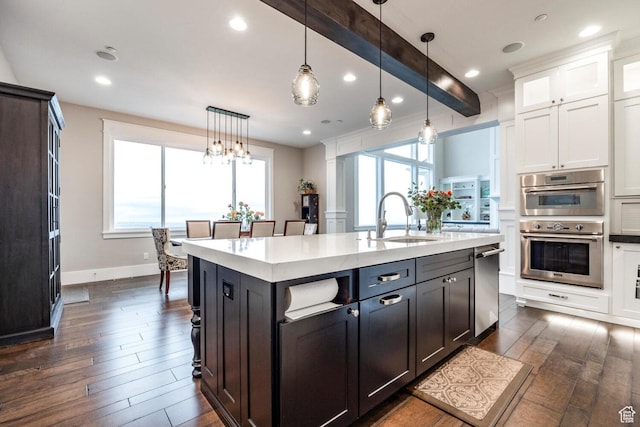5314 W Rolling Brook Dr, Herriman, UT 84096 - kitchen featuring dark wood finished floors, white cabinetry, stainless steel appliances, a sink, and light countertops