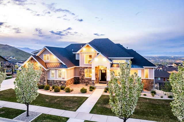 5314 W Rolling Brook Dr, Herriman, UT 84096 - craftsman-style house with stone siding, a standing seam roof, board and batten siding, metal roof, and roof with shingles
