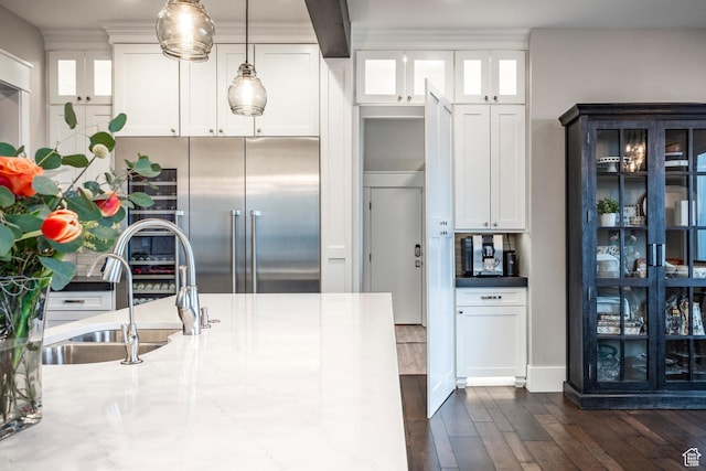5314 W Rolling Brook Dr, Herriman, UT 84096 - kitchen featuring stainless steel built in refrigerator, a sink, dark wood-style flooring, white cabinetry, and pendant lighting