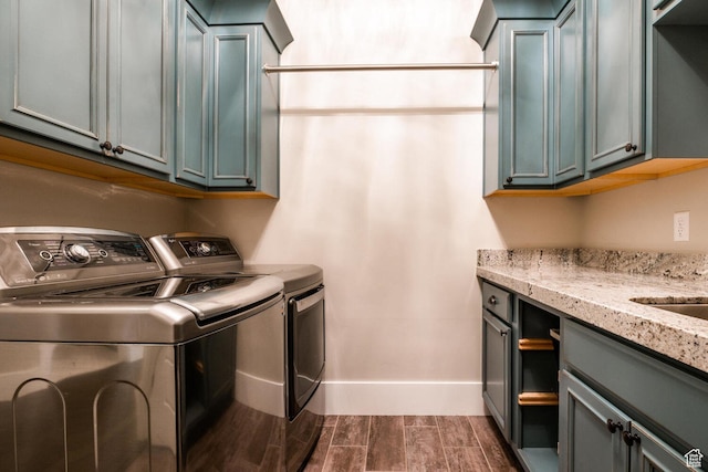 5314 W Rolling Brook Dr, Herriman, UT 84096 - washroom featuring cabinet space, separate washer and dryer, wood finish floors, and baseboards