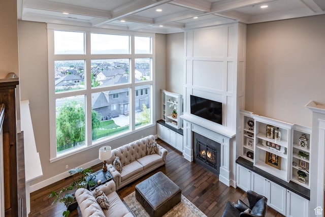 5314 W Rolling Brook Dr, Herriman, UT 84096 - living area with a glass covered fireplace, dark wood finished floors, beamed ceiling, coffered ceiling, and ornamental molding