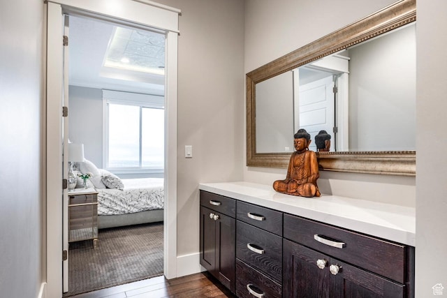 5314 W Rolling Brook Dr, Herriman, UT 84096 - bathroom with vanity, wood finished floors, connected bathroom, and baseboards