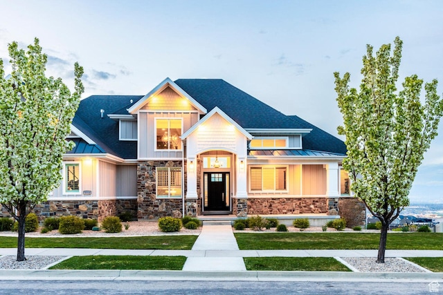5314 W Rolling Brook Dr, Herriman, UT 84096 - craftsman-style home featuring a standing seam roof, stone siding, board and batten siding, and metal roof