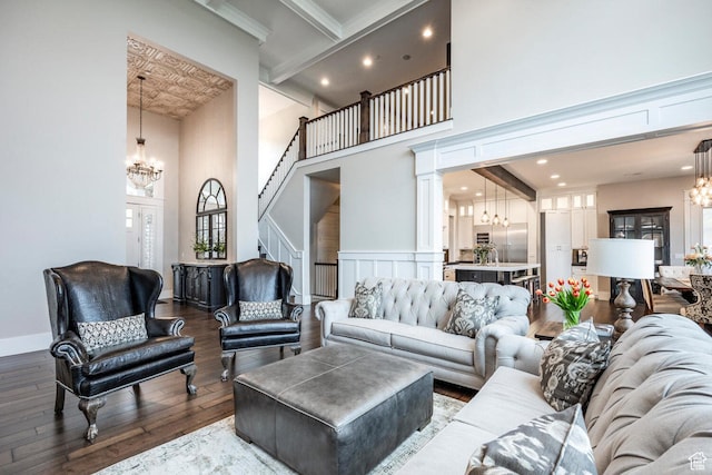 5314 W Rolling Brook Dr, Herriman, UT 84096 - living area featuring a chandelier, a high ceiling, hardwood / wood-style floors, stairs, and recessed lighting