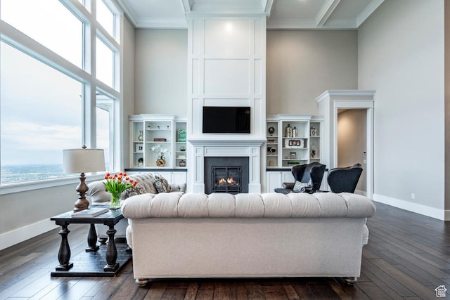 5314 W Rolling Brook Dr, Herriman, UT 84096 - living room with healthy amount of natural light, a glass covered fireplace, baseboards, and ornamental molding