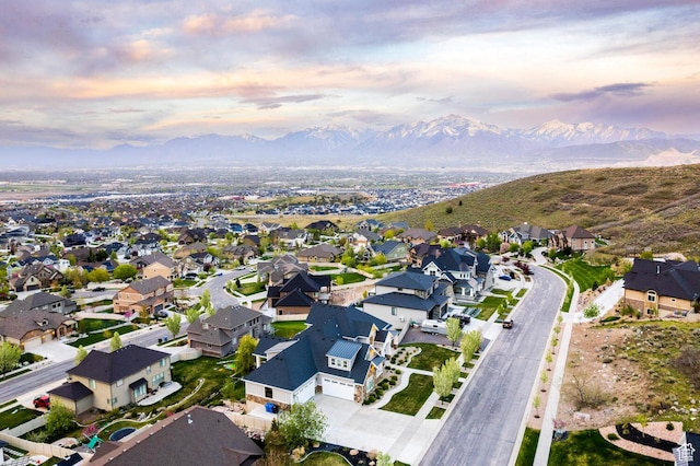 5314 W Rolling Brook Dr, Herriman, UT 84096 - aerial view of property and surrounding area with a mountainous background and nearby suburban area
