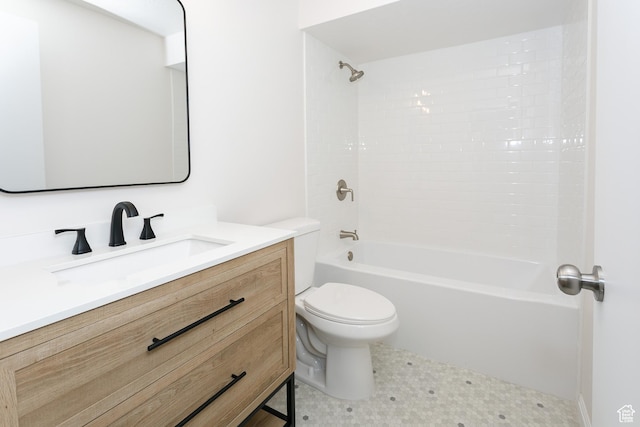 bathroom featuring toilet, vanity, and washtub / shower combination