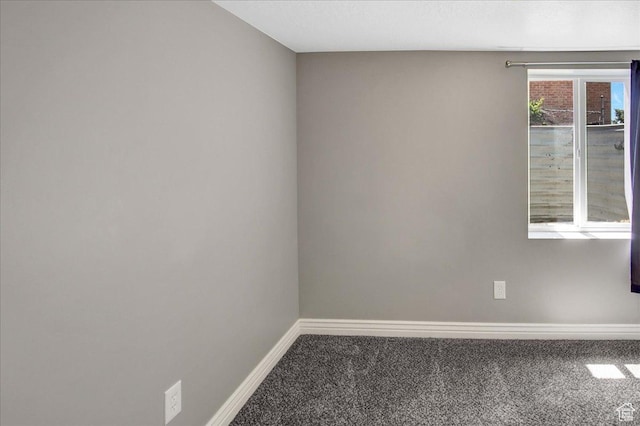 spare room with carpet flooring and baseboards