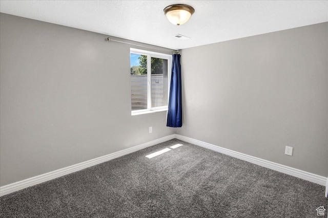 spare room with carpet flooring and baseboards