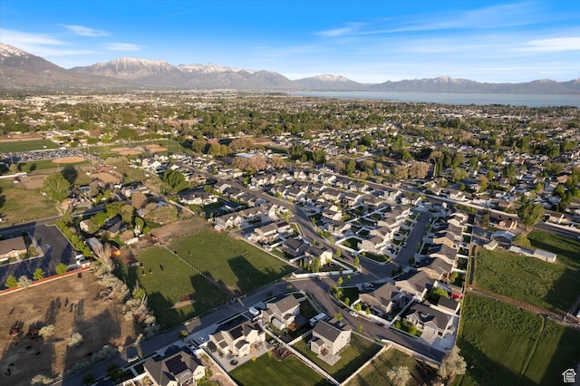 aerial view of property's location with mountains and nearby suburban area